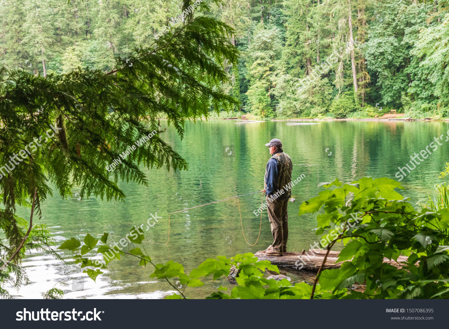stock photo usa washington state battle ground lake state park august a fisherman at the lake 1507086395